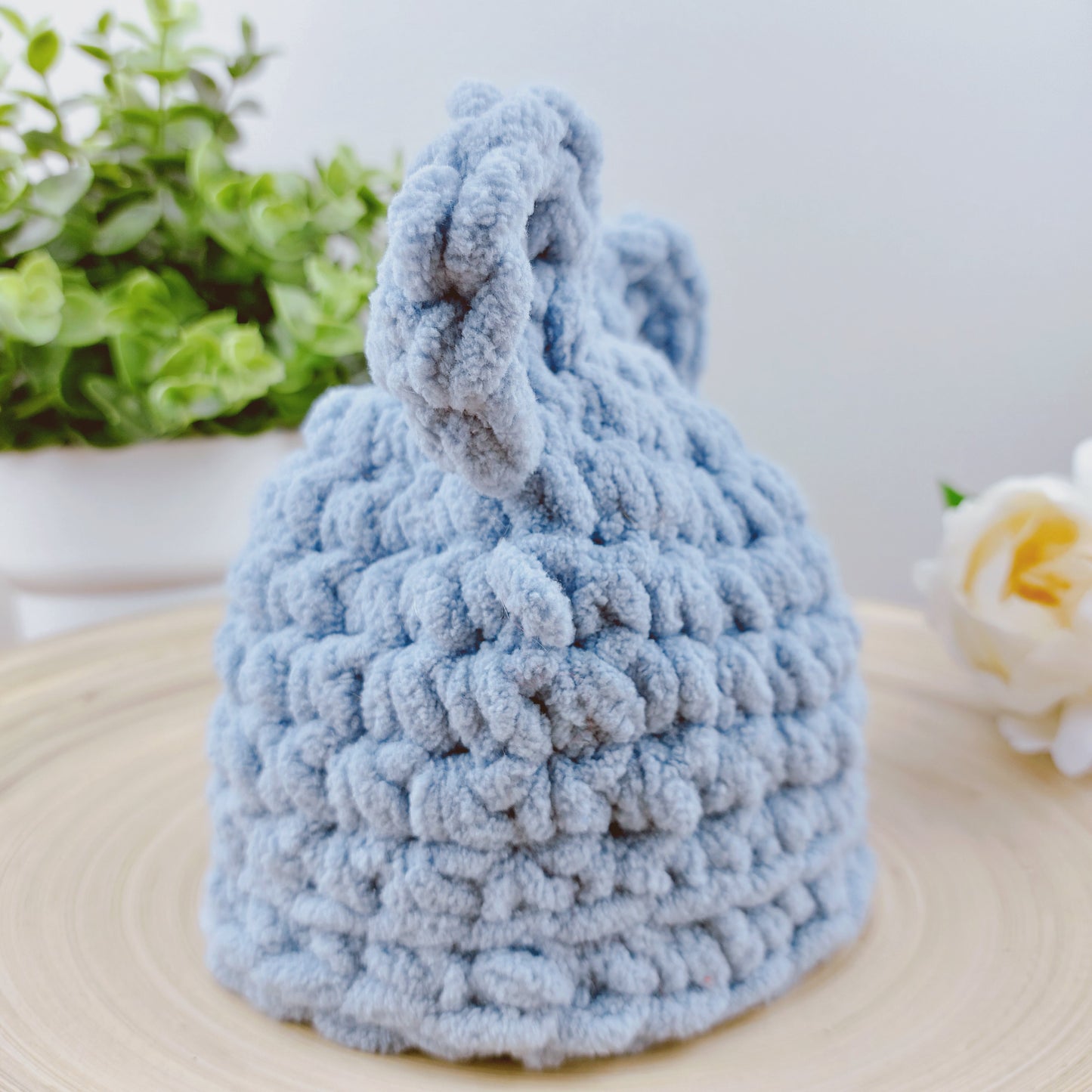 Side view of blue baby bear hat