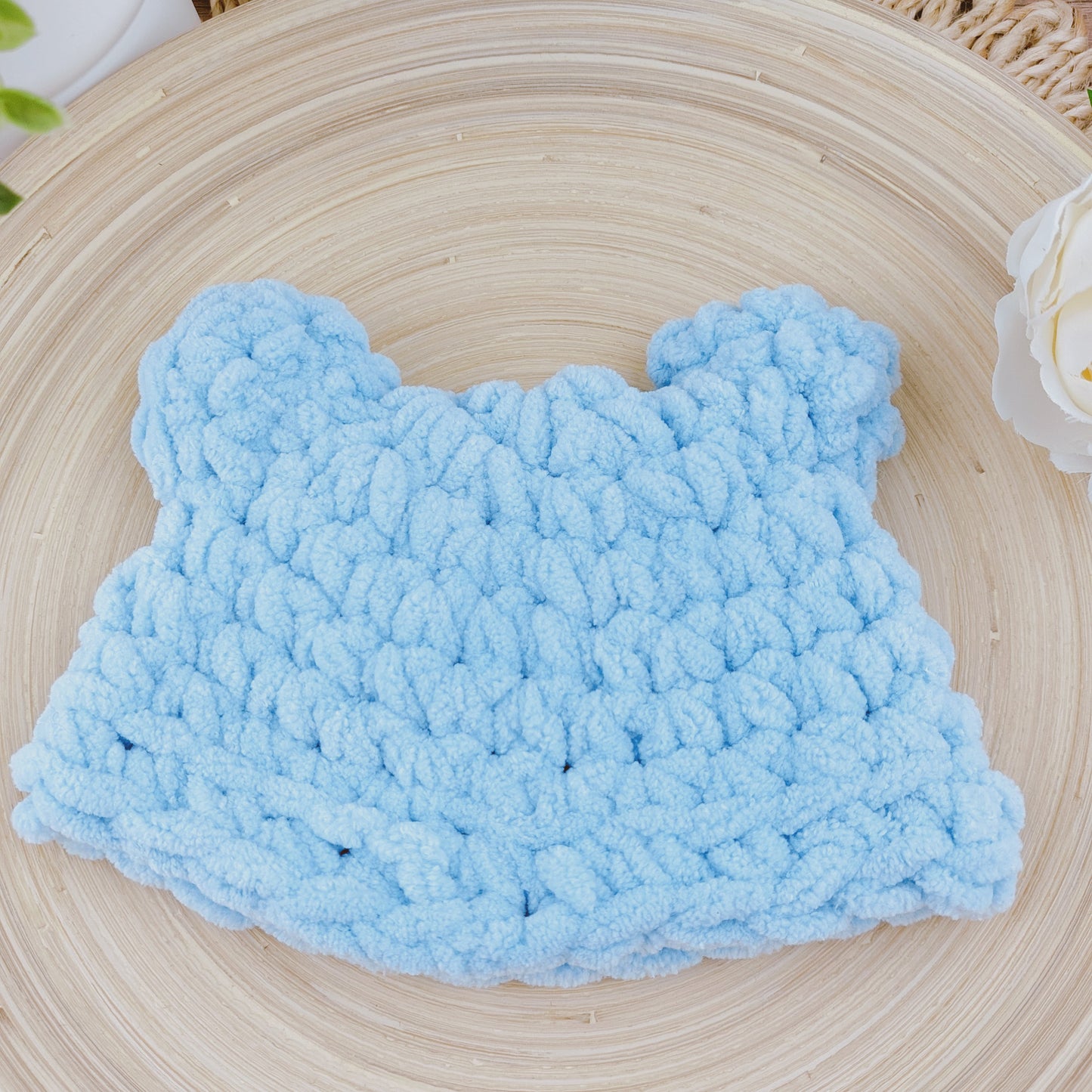 Rear view of pale blue baby bear hat